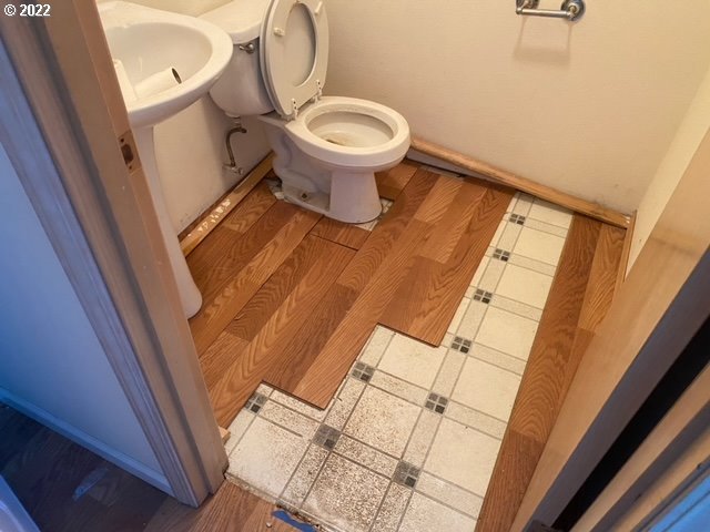 1675 Makinster Road Tillamook, OR 97141 - Photo 29 of 29 a white toilet sitting next to a sink