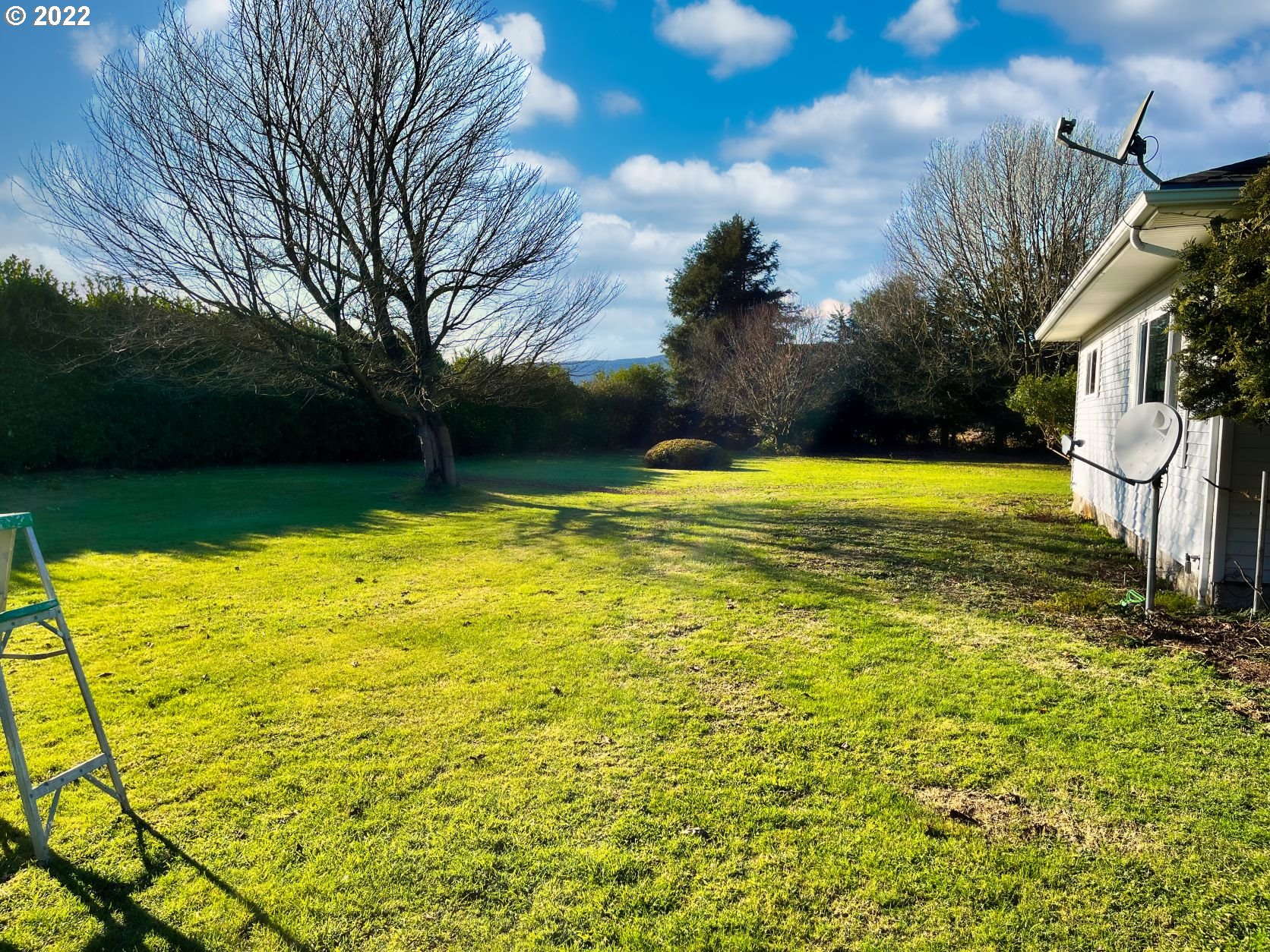 1675 Makinster Road Tillamook, OR 97141 - Photo 3 of 29 a view of a swimming pool with an outdoor space and seating area
