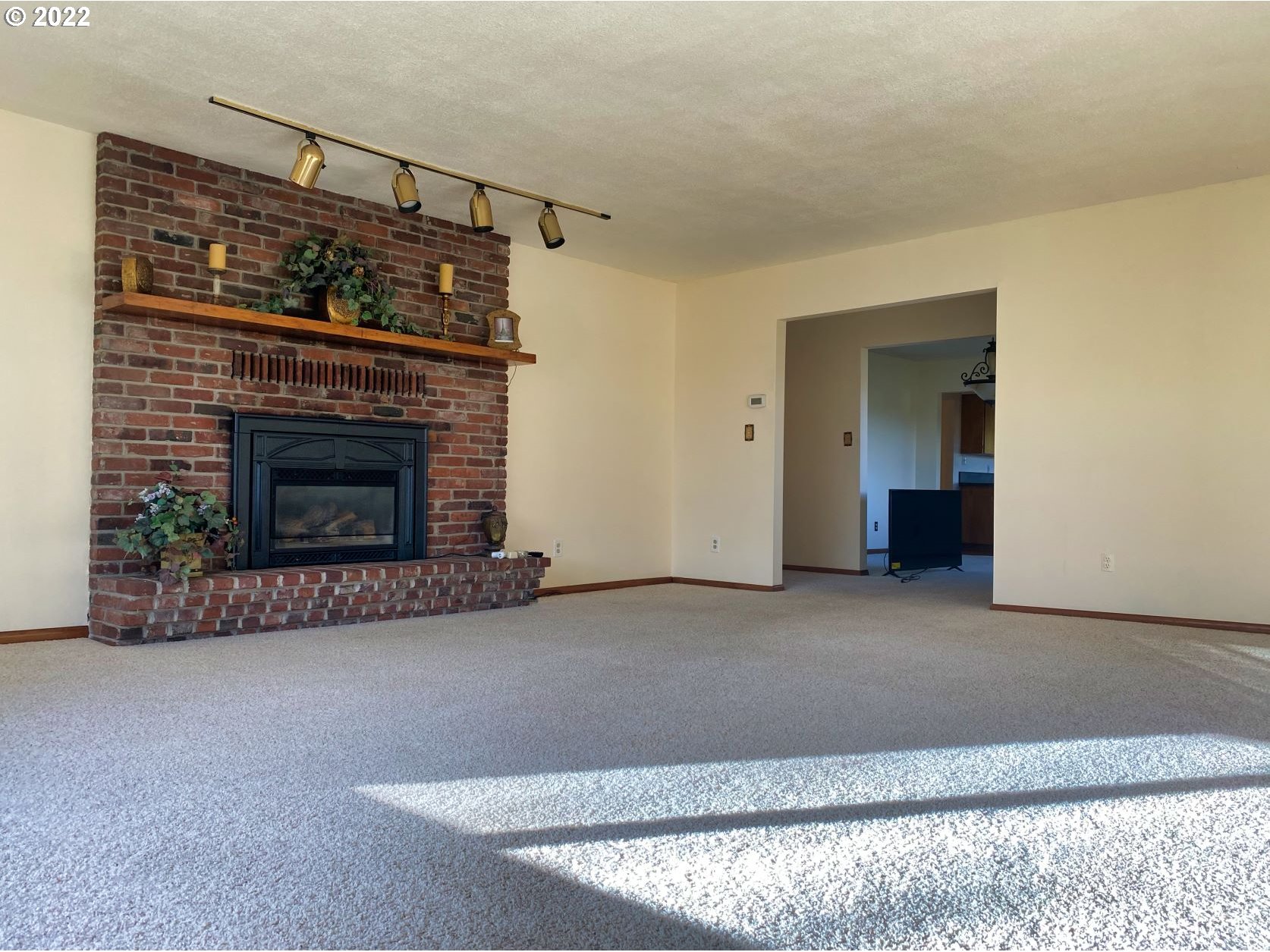 1675 Makinster Road Tillamook, OR 97141 - Photo 4 of 29 a living room with a fireplace