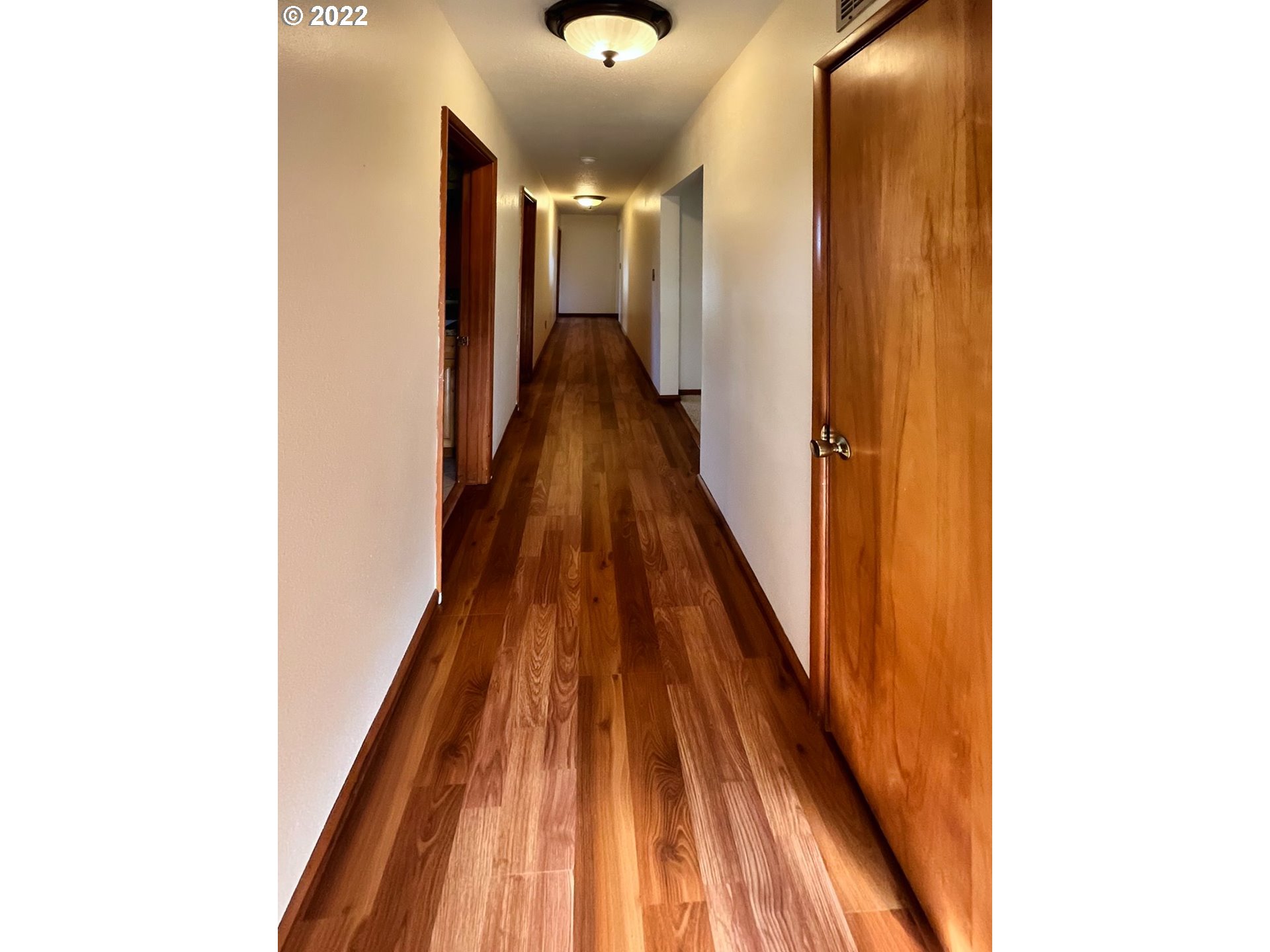 1675 Makinster Road Tillamook, OR 97141 - Photo 8 of 29 a view of a hallway with wooden floor