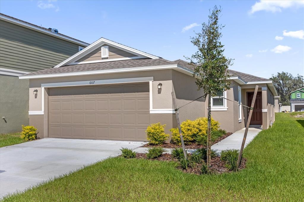 607 Alder Lane Auburndale, FL 33823 - Photo 1 of 1 a front view of a house with a yard