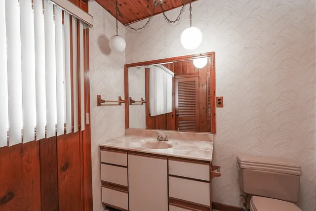 a view of an empty room with a fireplace