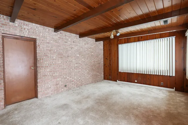 a utility room with cabinets washer and dryer