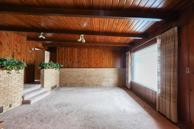 a view of room with furniture and a potted plant