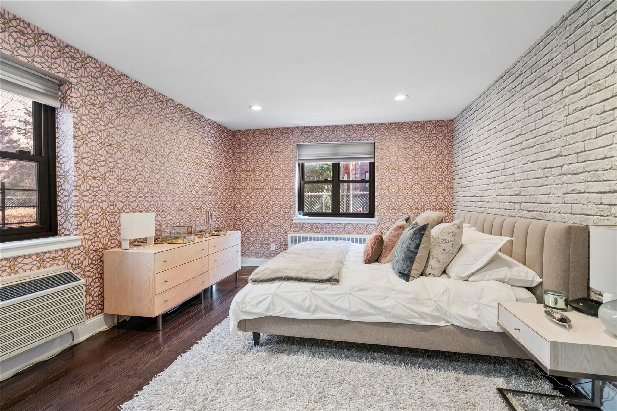 50 Brompton Road, Unit 1T Great Neck, NY 11021 - Photo 19 of 33 a bedroom with bed and window