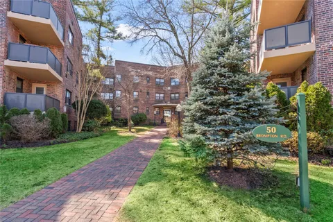 a view of a building with a garden