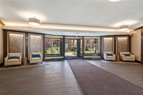 a view of room with balcony and large windows