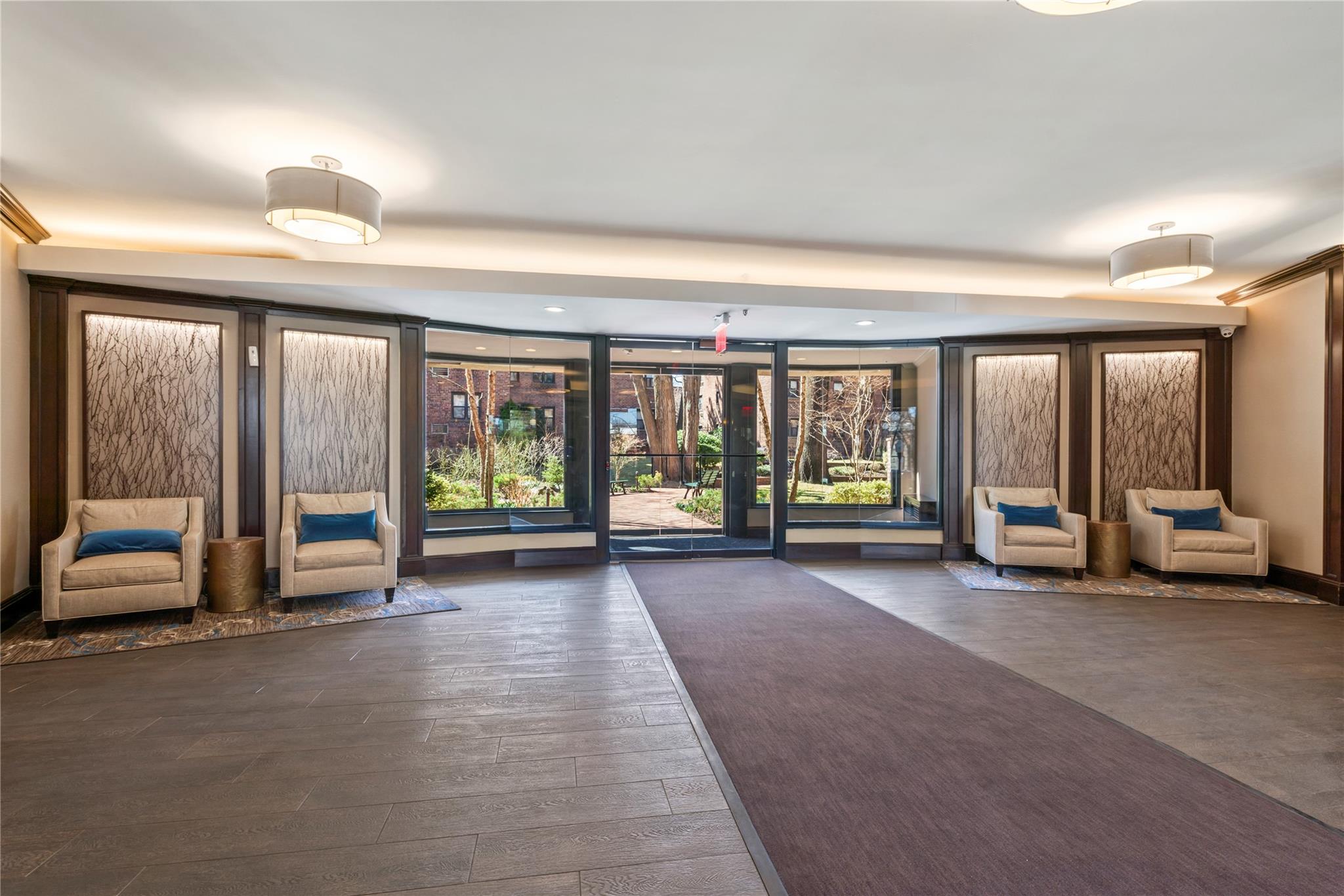 50 Brompton Road, Unit 1T Great Neck, NY 11021 - Photo 26 of 33 a view of room with balcony and large windows