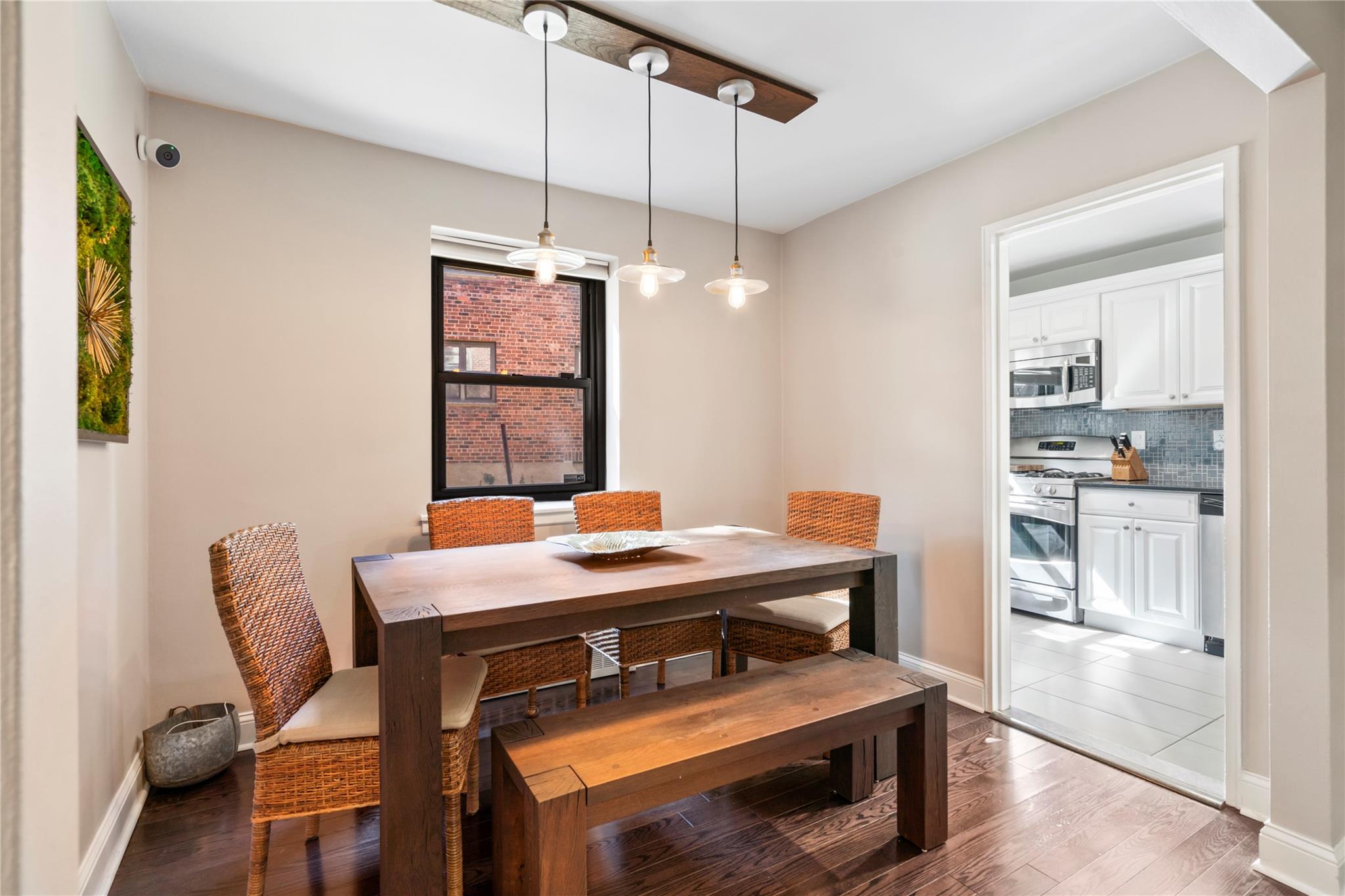 50 Brompton Road, Unit 1T Great Neck, NY 11021 - Photo 5 of 33 a view of a dining room with furniture and window