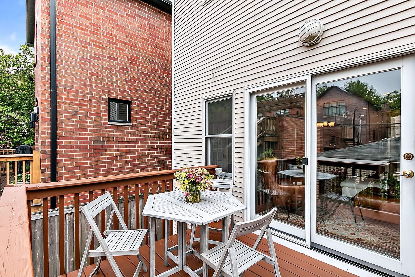 1910 West Barry Avenue Chicago, IL 60657 - Photo 15 of 33 a view of a patio with table and chairs and potted plants