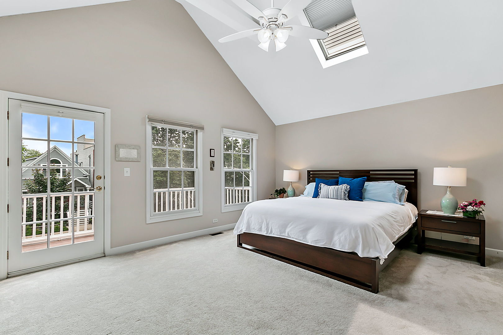 1910 West Barry Avenue Chicago, IL 60657 - Photo 17 of 33 a spacious bedroom with a large bed and a chandelier