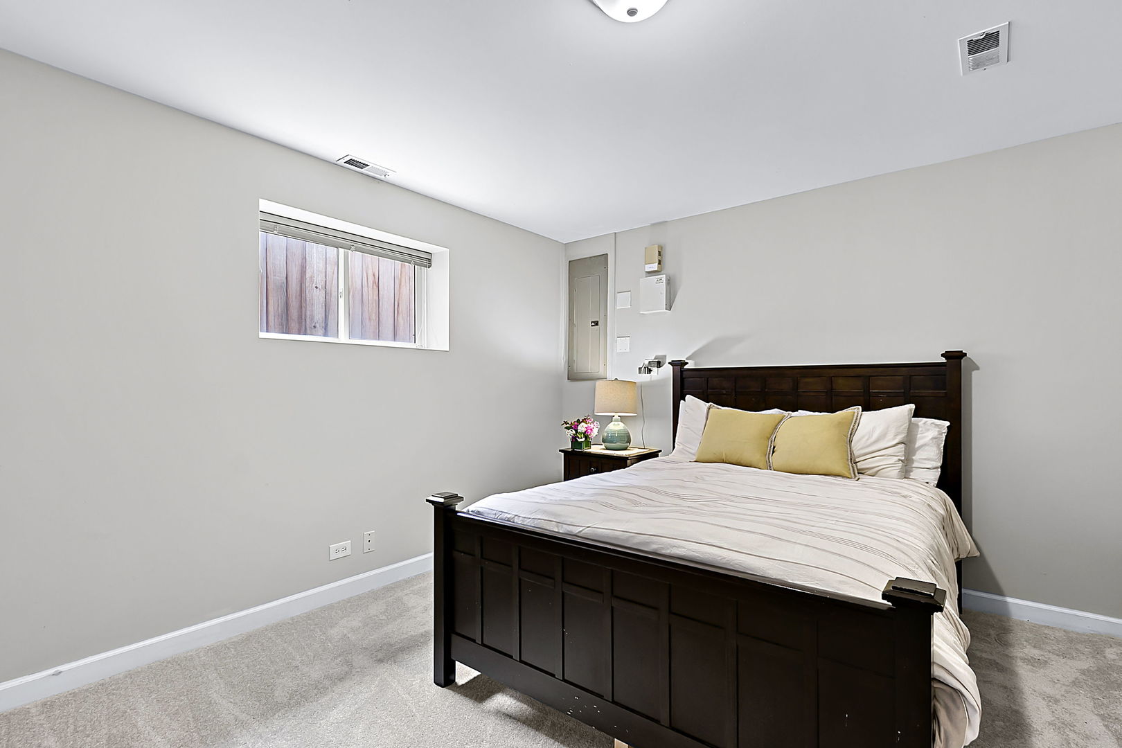 1910 West Barry Avenue Chicago, IL 60657 - Photo 30 of 33 a bedroom with a bed and a night stand