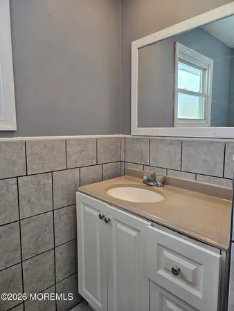 a bathroom with a sink and vanity