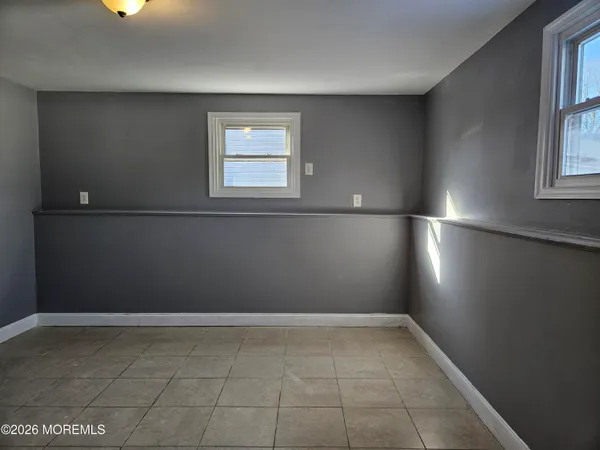 a view of an empty room with windows