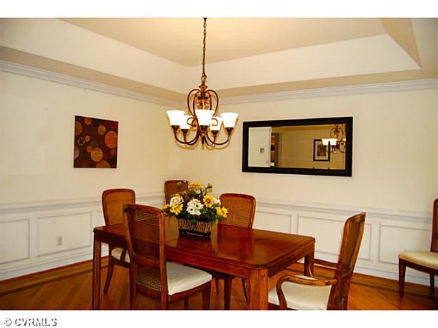 14411 Helmsley Road Midlothian, VA 23113 - Photo 4 of 17 Den/Family/Great Room - Great space which opens to the sunroom and kitchen! Gas fireplace, built-in bookcases and speakers. Hardwood floors.