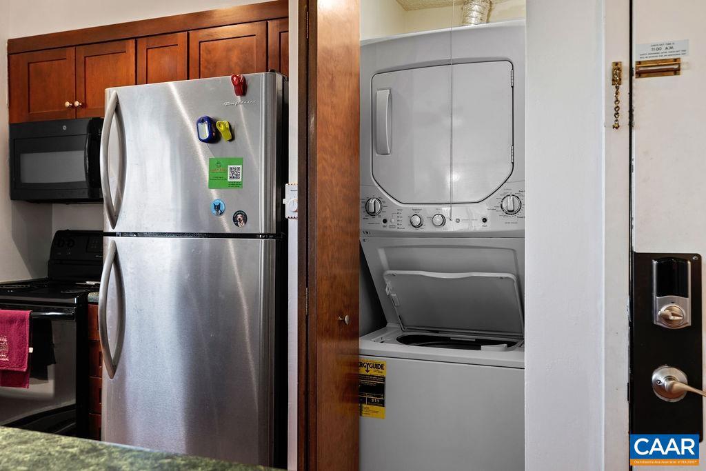 2224 Tanners Ridge, Unit 2224 Wintergreen, VA 22967 - Photo 6 of 18 a utility room with dryer and washer