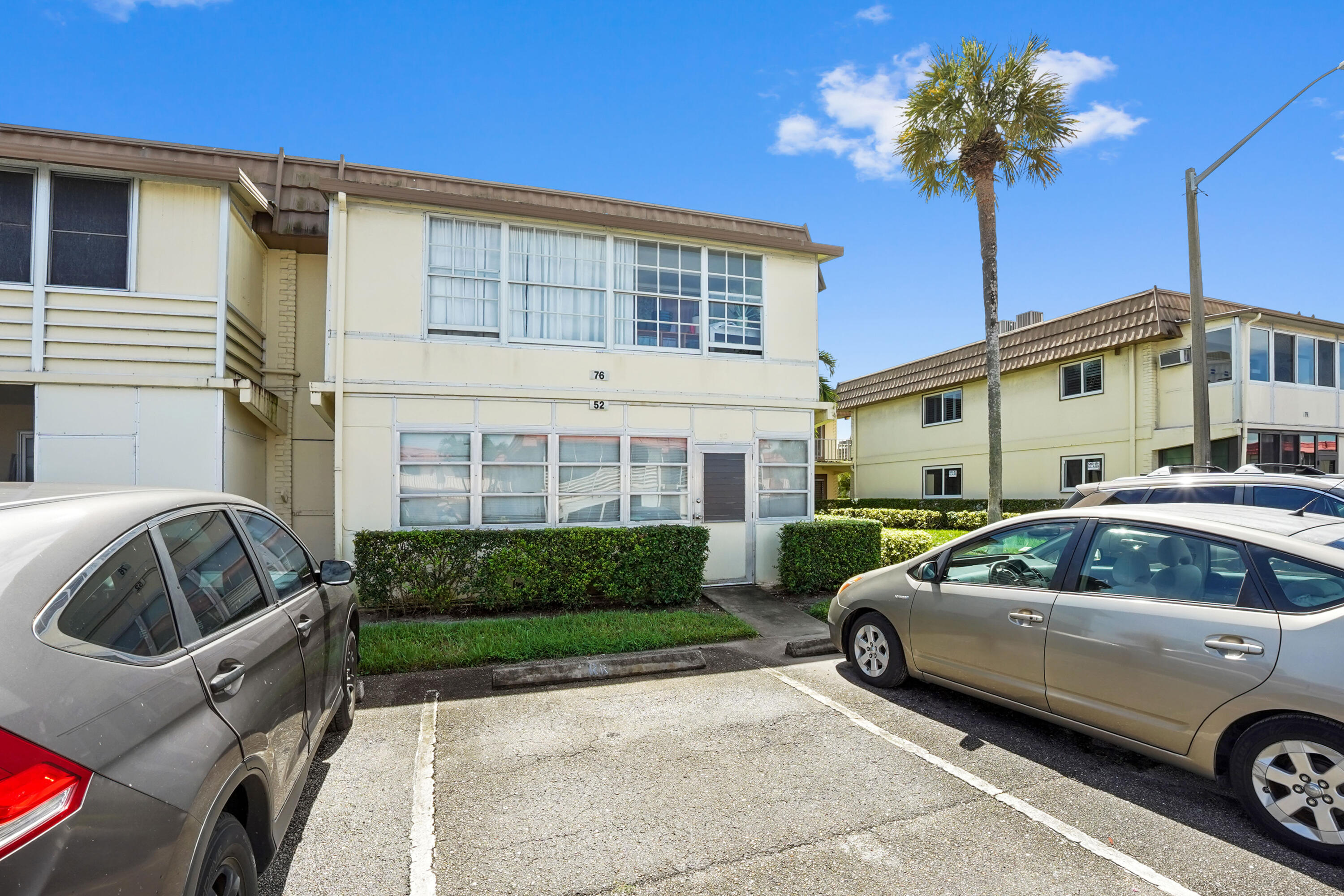 52 Saxony B Delray Beach, FL 33446 - Photo 20 of 21 a view of a car parked front of a house