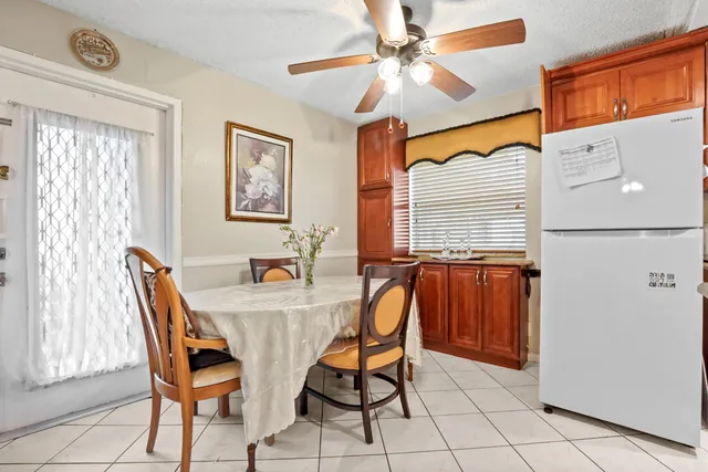 a dining room with furniture and window