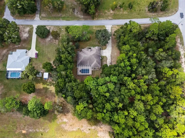 a living room with furniture a flat screen tv and a large window