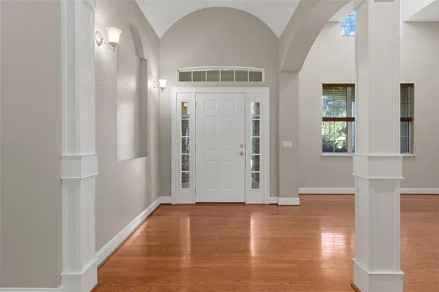 a view of a dining room with furniture and window