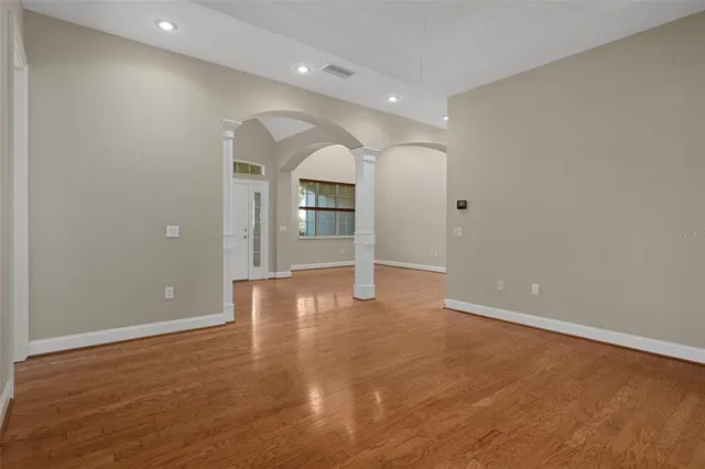 a large kitchen with a large counter top stainless steel appliances and cabinets