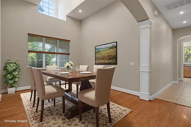 a kitchen with stainless steel appliances granite countertop a sink a stove and a wooden cabinets