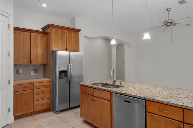 a large bathroom with a double vanity sink mirror and toilet