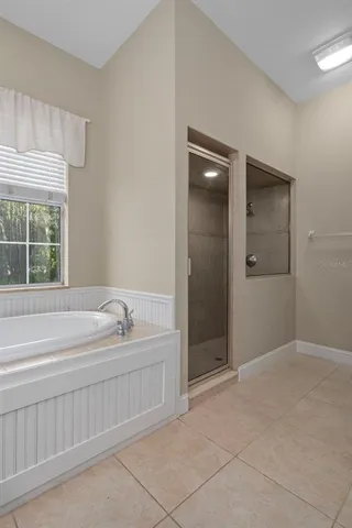 a view of a white building with a swimming pool