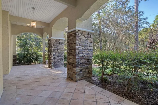 a front view of a house with a yard and porch