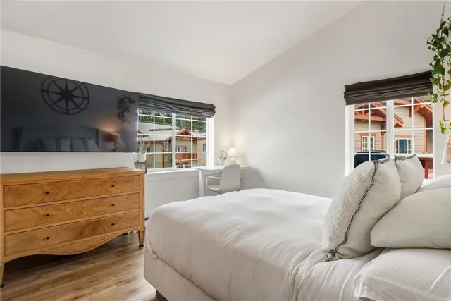 a bed room with a bed and a window