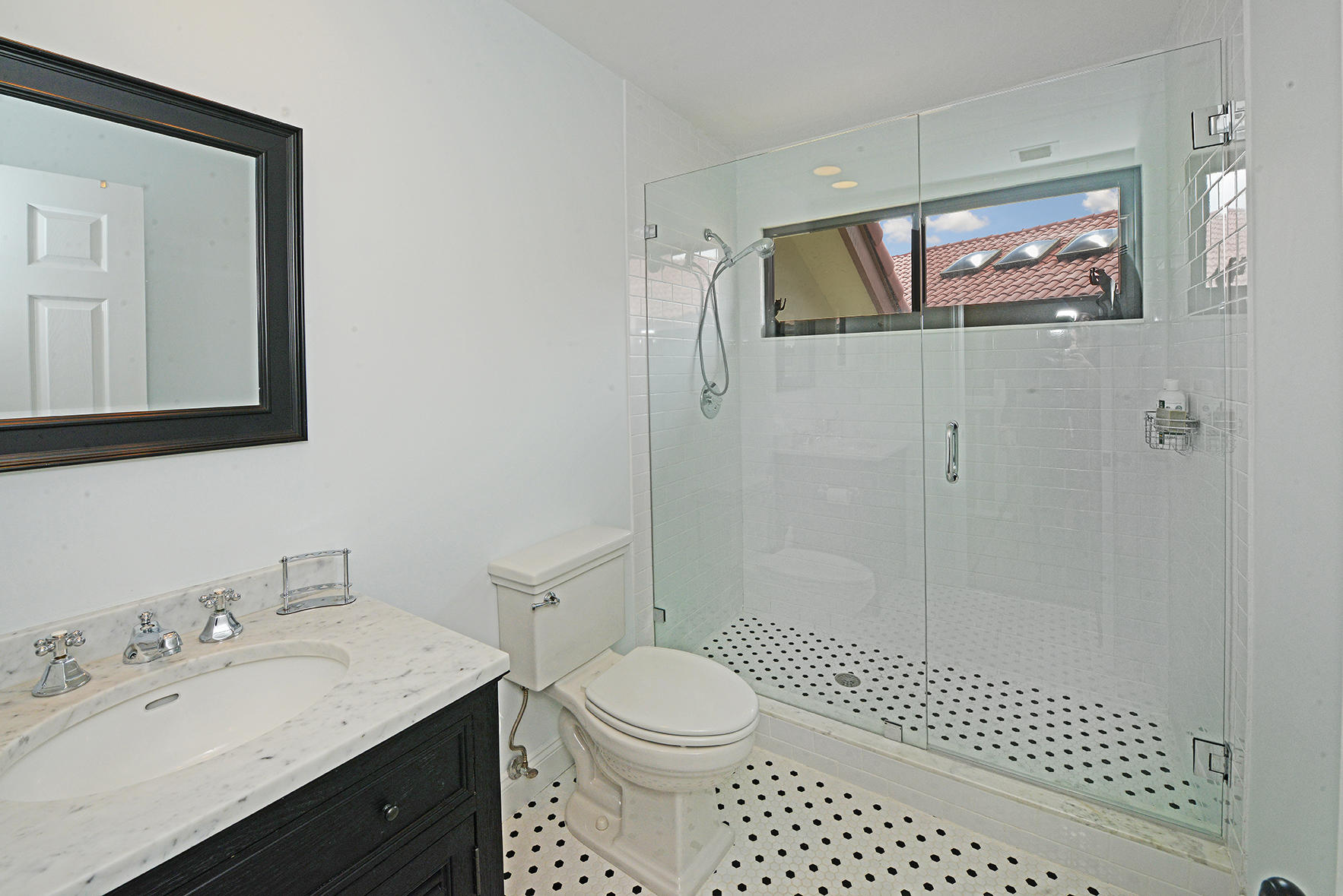 21760 Club Villa Terrace Boca Raton, FL 33433 - Photo 34 of 38 a bathroom with a sink a toilet and shower