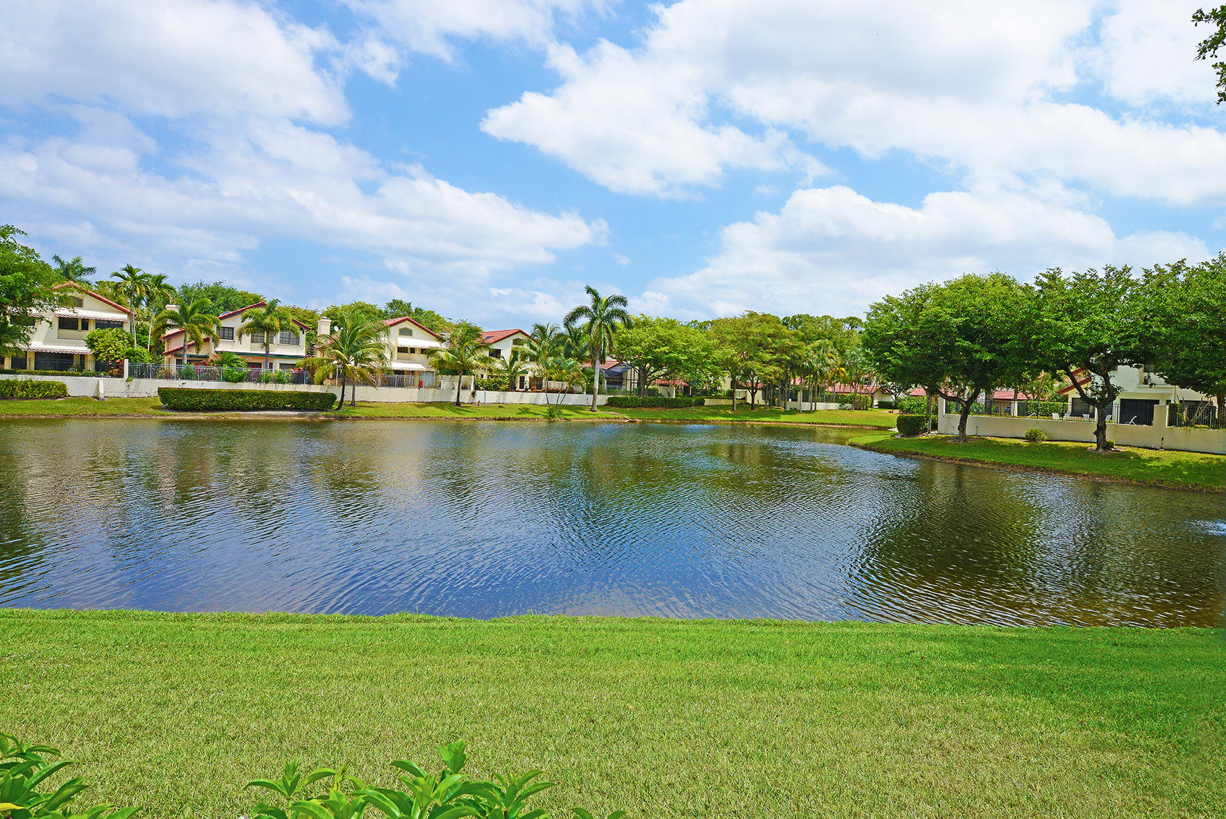 21760 Club Villa Terrace Boca Raton, FL 33433 - Photo 10 of 38 a view of a lake with houses in the background