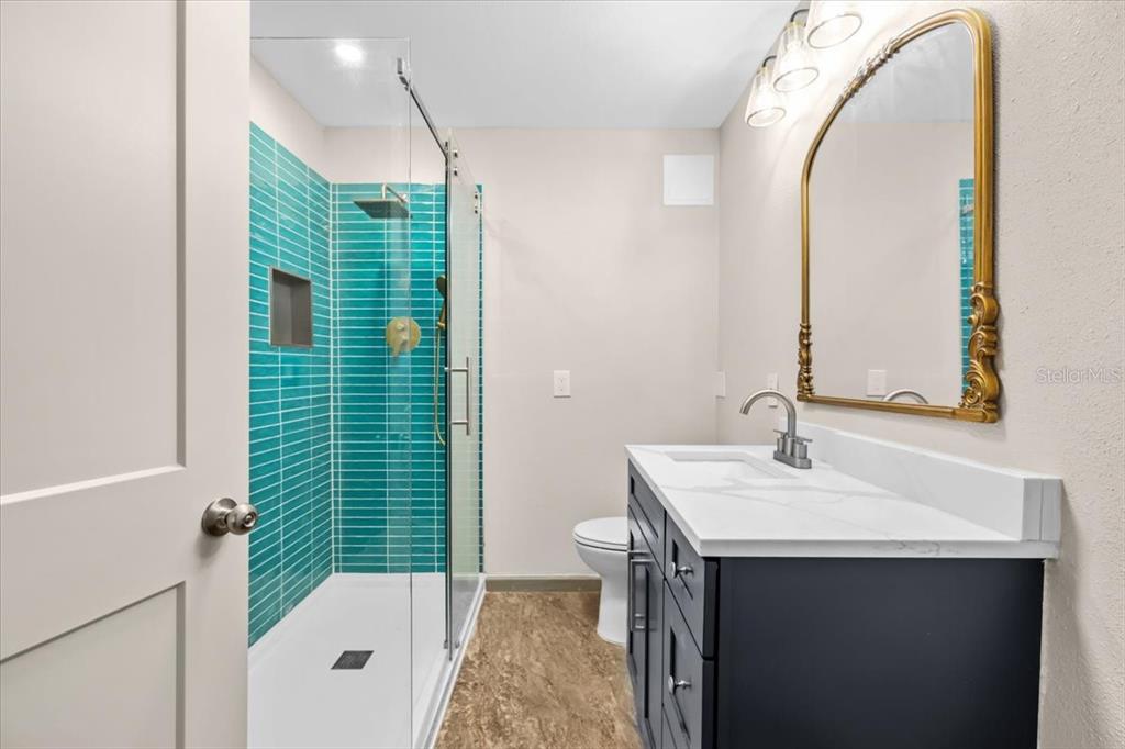 4880 Shell Stream Boulevard New Port Richey, FL 34652 - Photo 13 of 25 a bathroom with a sink and a mirror