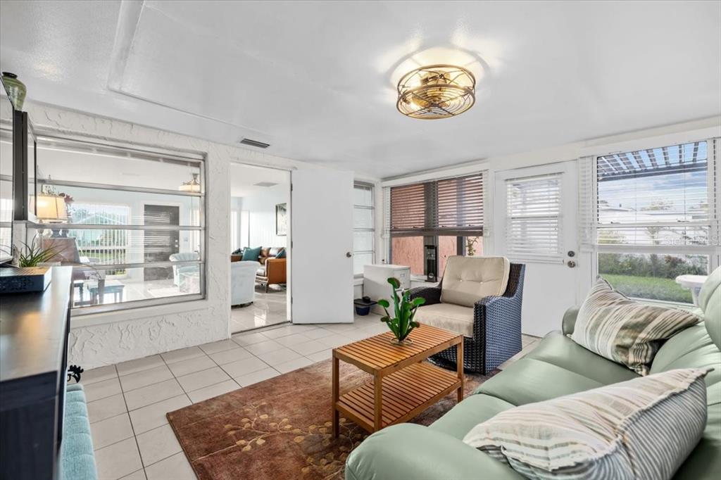4880 Shell Stream Boulevard New Port Richey, FL 34652 - Photo 14 of 57 a living room with furniture and a large window
