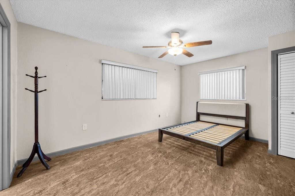 4880 Shell Stream Boulevard New Port Richey, FL 34652 - Photo 20 of 57 a living room with furniture and a chandelier