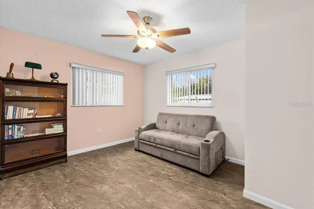 a bedroom with bed and a chandelier