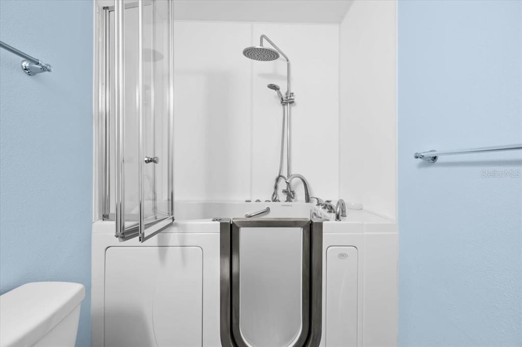 4880 Shell Stream Boulevard New Port Richey, FL 34652 - Photo 32 of 57 a view of a hallway with washer and dryer