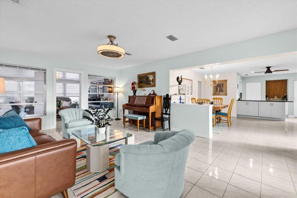4880 Shell Stream Boulevard New Port Richey, FL 34652 - Photo 8 of 57 a living room with furniture and kitchen view