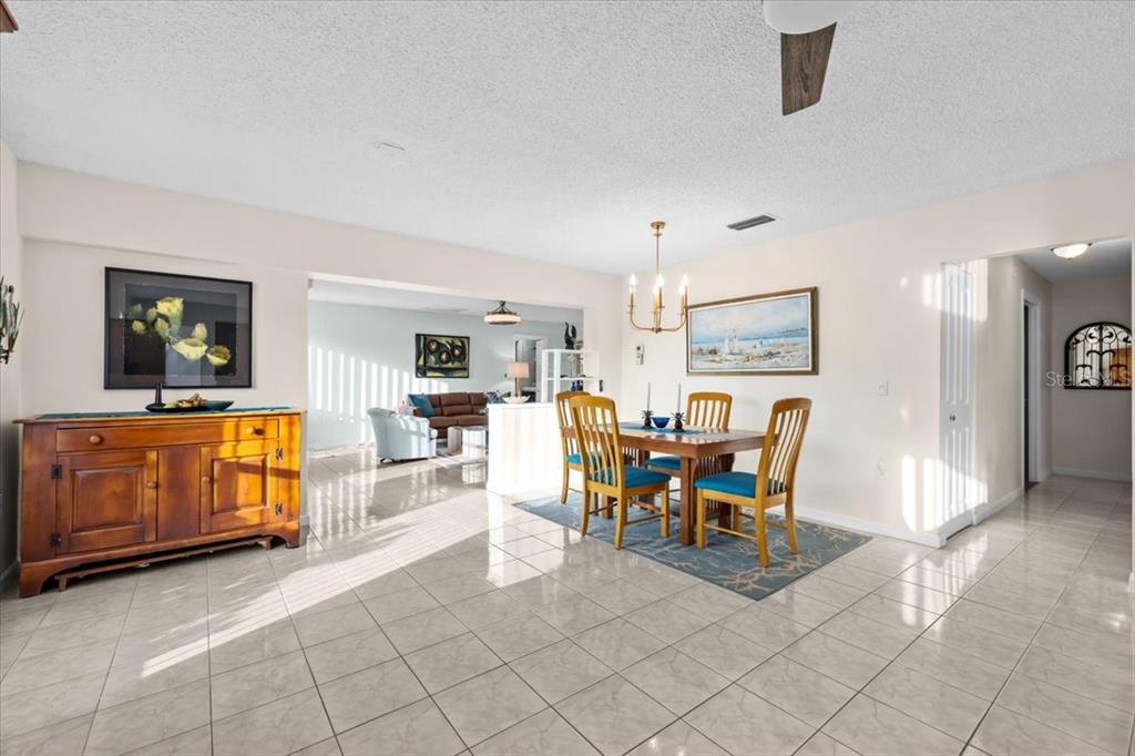4880 Shell Stream Boulevard New Port Richey, FL 34652 - Photo 10 of 25 a dining room with furniture and a view of living room