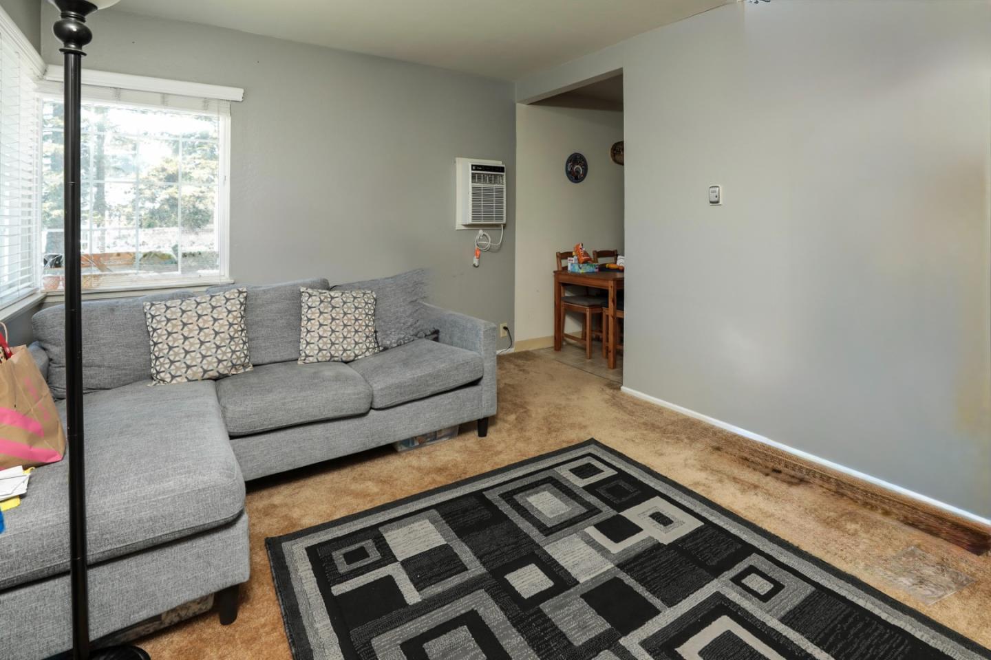 494 Dover Way Campbell, CA 95008 - Photo 12 of 28 a living room with furniture and a rug