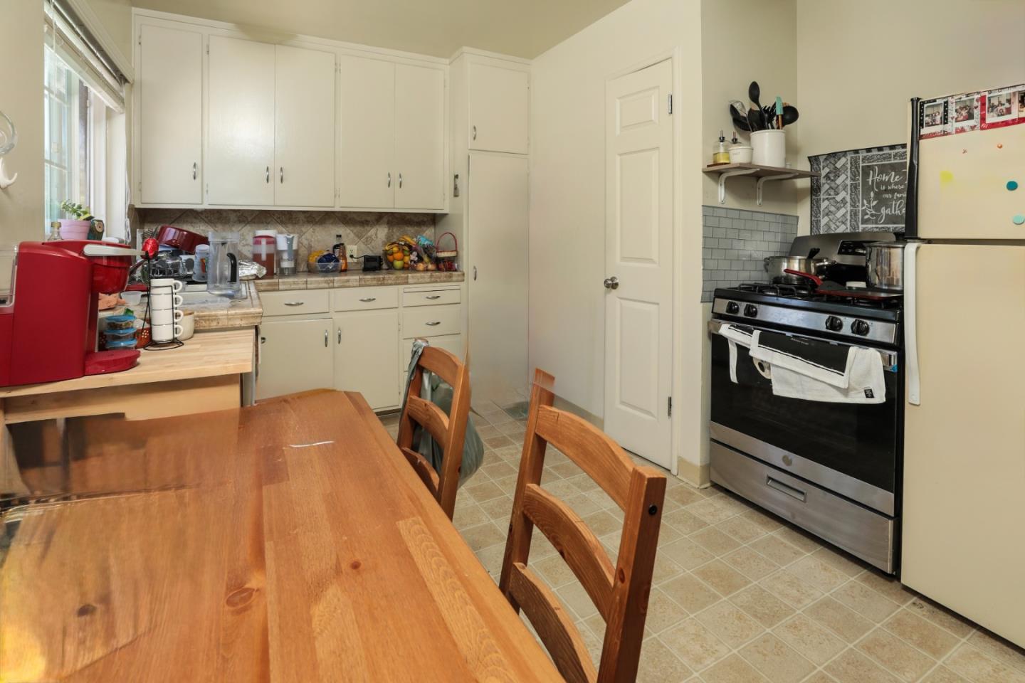 494 Dover Way Campbell, CA 95008 - Photo 13 of 28 a kitchen with stainless steel appliances granite countertop a stove a refrigerator and a microwave