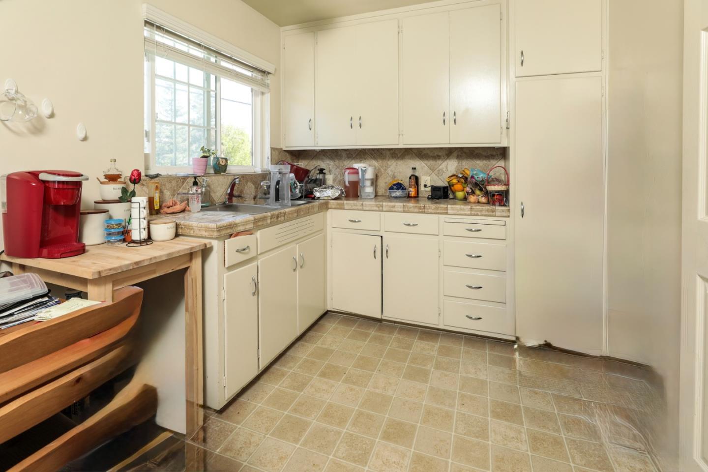 494 Dover Way Campbell, CA 95008 - Photo 14 of 28 a kitchen with granite countertop white cabinets stainless steel appliances a sink and a window