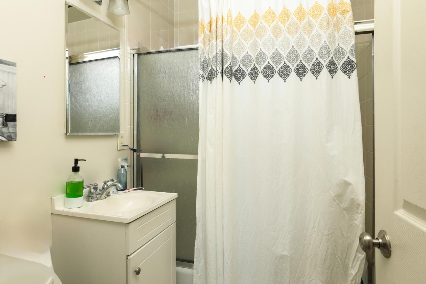 494 Dover Way Campbell, CA 95008 - Photo 16 of 28 a bathroom with a sink and mirror