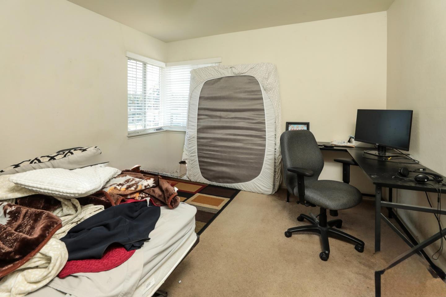 494 Dover Way Campbell, CA 95008 - Photo 19 of 28 a bedroom with a bed and a chair
