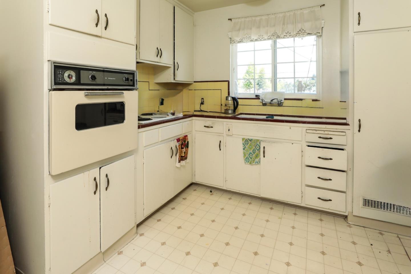 494 Dover Way Campbell, CA 95008 - Photo 21 of 28 a kitchen with a stove a sink and a window