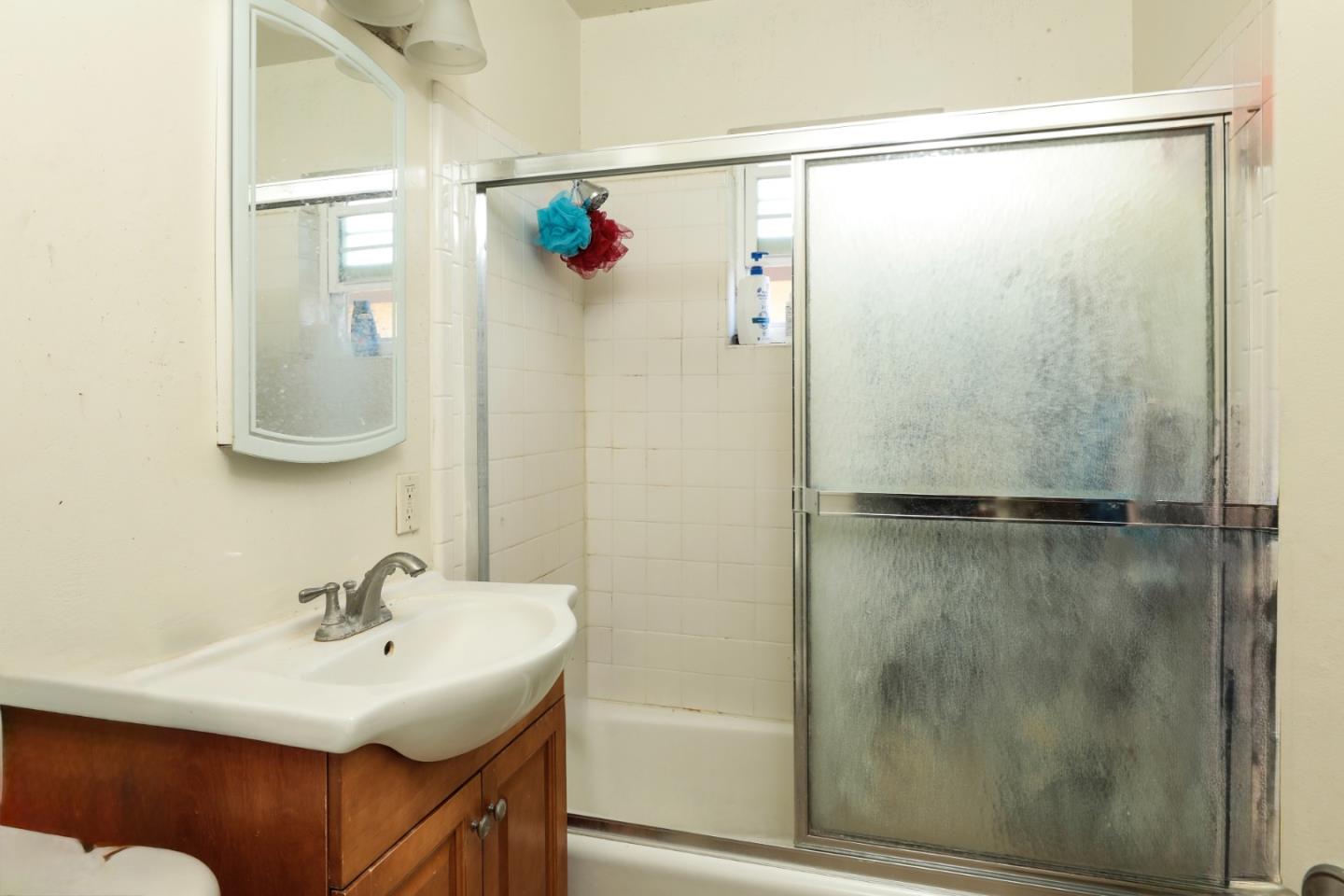 494 Dover Way Campbell, CA 95008 - Photo 23 of 28 a bathroom with a sink and a mirror
