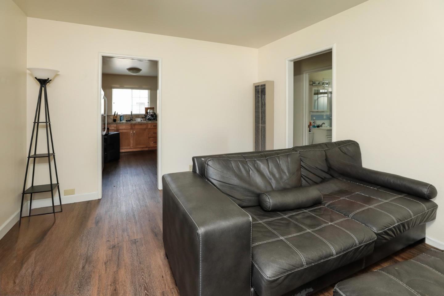 494 Dover Way Campbell, CA 95008 - Photo 24 of 28 a living room with a couch and a wooden floor