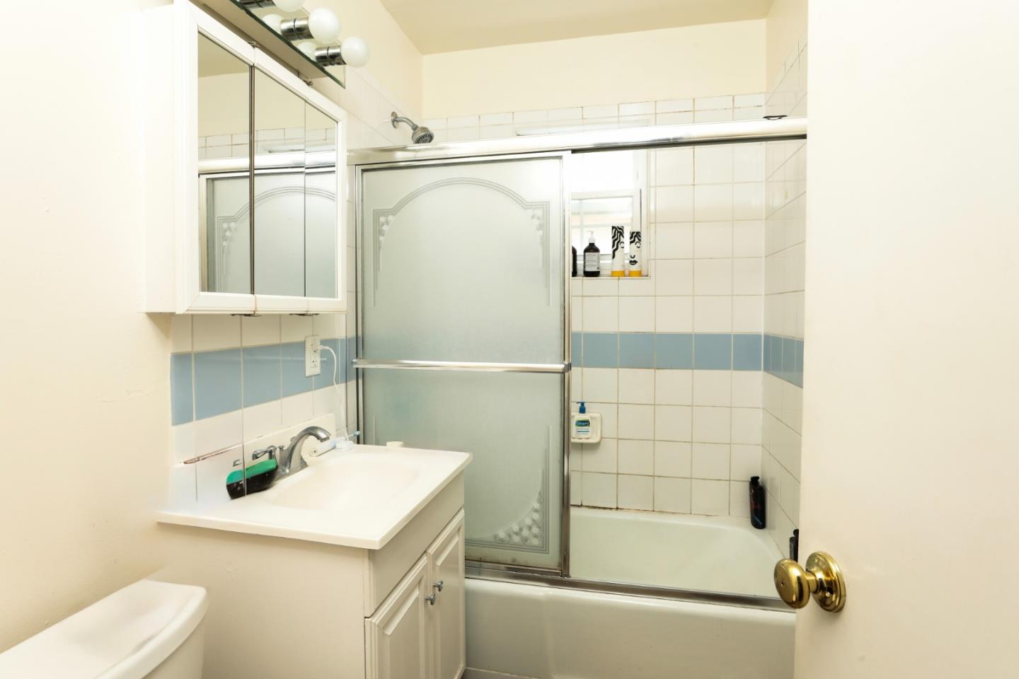 494 Dover Way Campbell, CA 95008 - Photo 28 of 28 a bathroom with a sink and mirror with bathtub