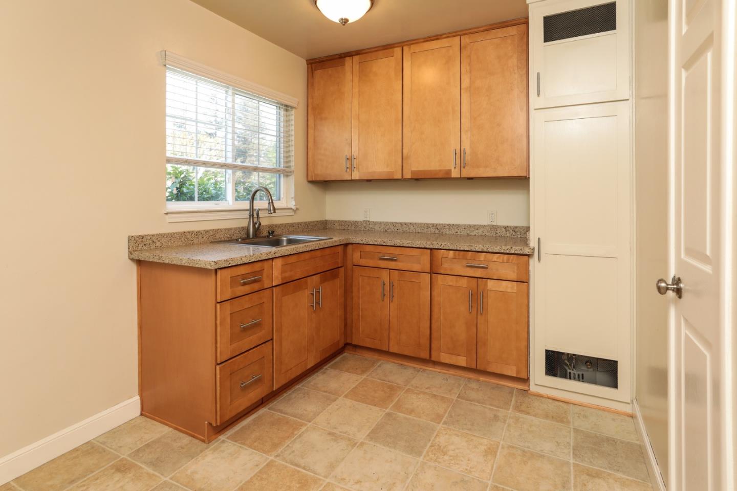 494 Dover Way Campbell, CA 95008 - Photo 3 of 28 a kitchen with a sink window and cabinets