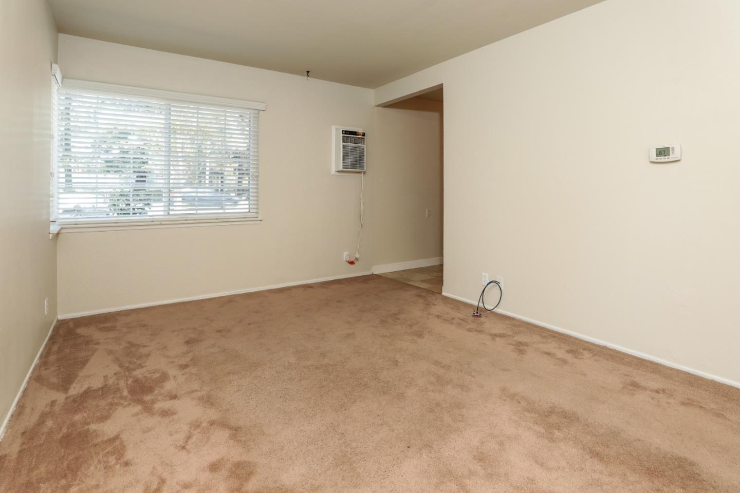 494 Dover Way Campbell, CA 95008 - Photo 6 of 28 an empty room with windows